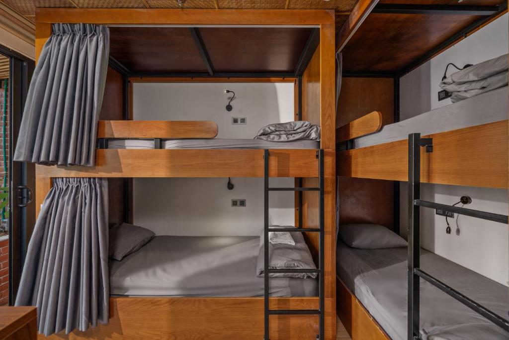 Bunk Bed in Female Dormitory Room with Curtain