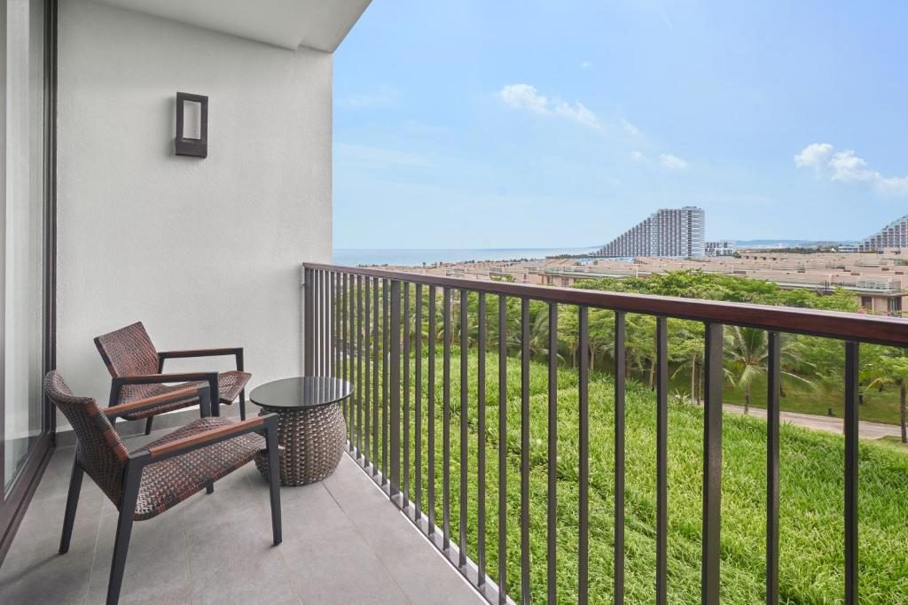 Deluxe Garden view with Two Double Beds and Balcony